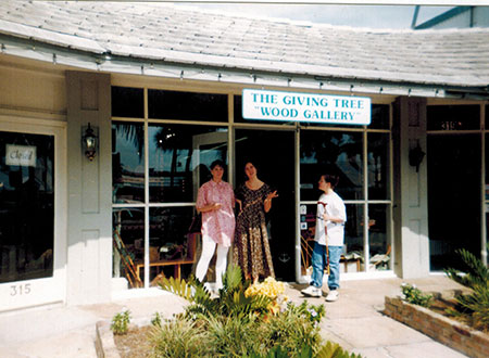 Employees in front of wood gallery